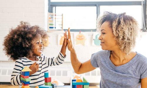 Toddler and mother playing together